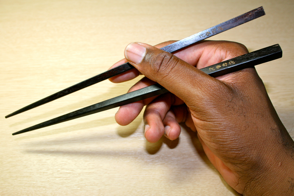 chopstick etiquette, Japanese table manners, what not to do with chopsticks, chopstick rules, Japanese dining etiquette, how to use chopsticks, sushi etiquette, Japanese restaurant etiquette, dining etiquette Japan, Japan travel tips, proper chopstick use