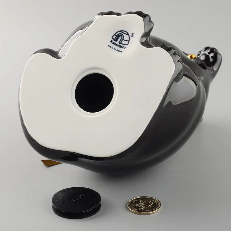 Maneki Neko coin bank, porcelain lucky cat bank, Hizen Yoshida Ware Maneki Neko, KataKoto beckoning cat, Japanese money box cat, black Maneki Neko bank, white Maneki Neko bank, Japanese store opening gift, ceramic cat coin bank, traditional Japanese porcelain cat, chubby lucky cat figurine, handcrafted Maneki Neko Japan, black gold lucky cat ornament, white navy Maneki Neko money bank, Japanese prosperity charm, artisan porcelain Maneki Neko.