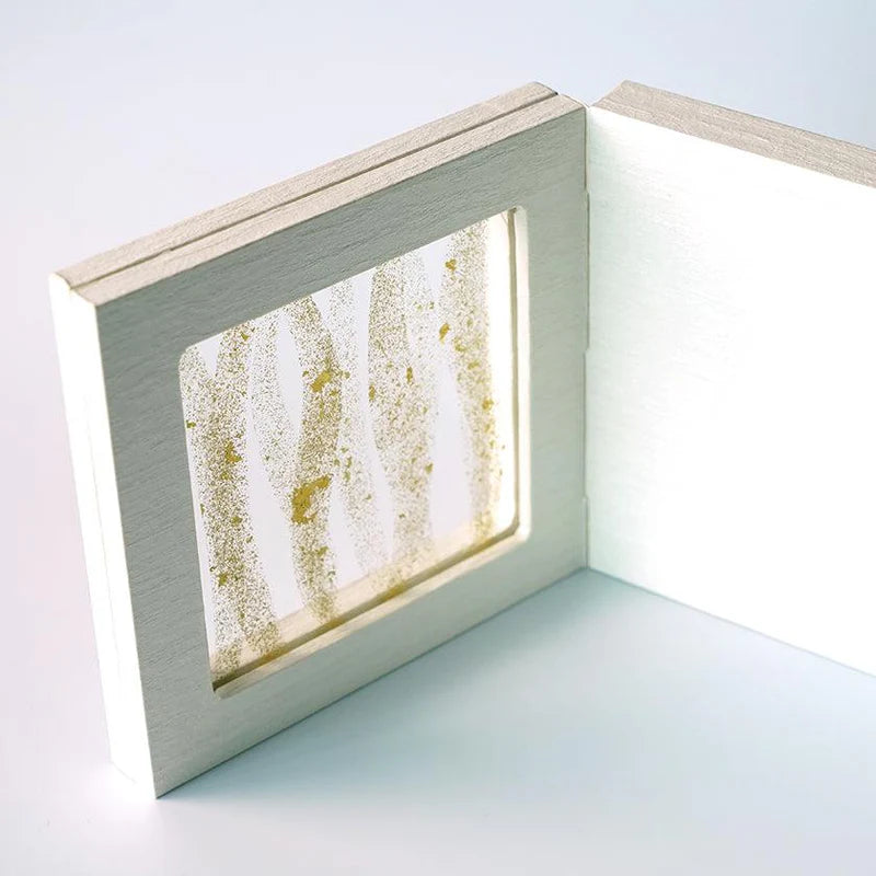 Japanese decorative panel, SUKIMA art panel, gold leaf glass art, silver leaf Japanese paper, Tokyo handmade decor, washi paper home decor, fusuma inspired decoration, modern Japanese interior design, Japanese wedding gift, Japanese housewarming gift, tabletop folding screen, artisan glass and wood panel, gold and silver foil decoration, traditional Japanese craftsmanship, handmade Japanese art display