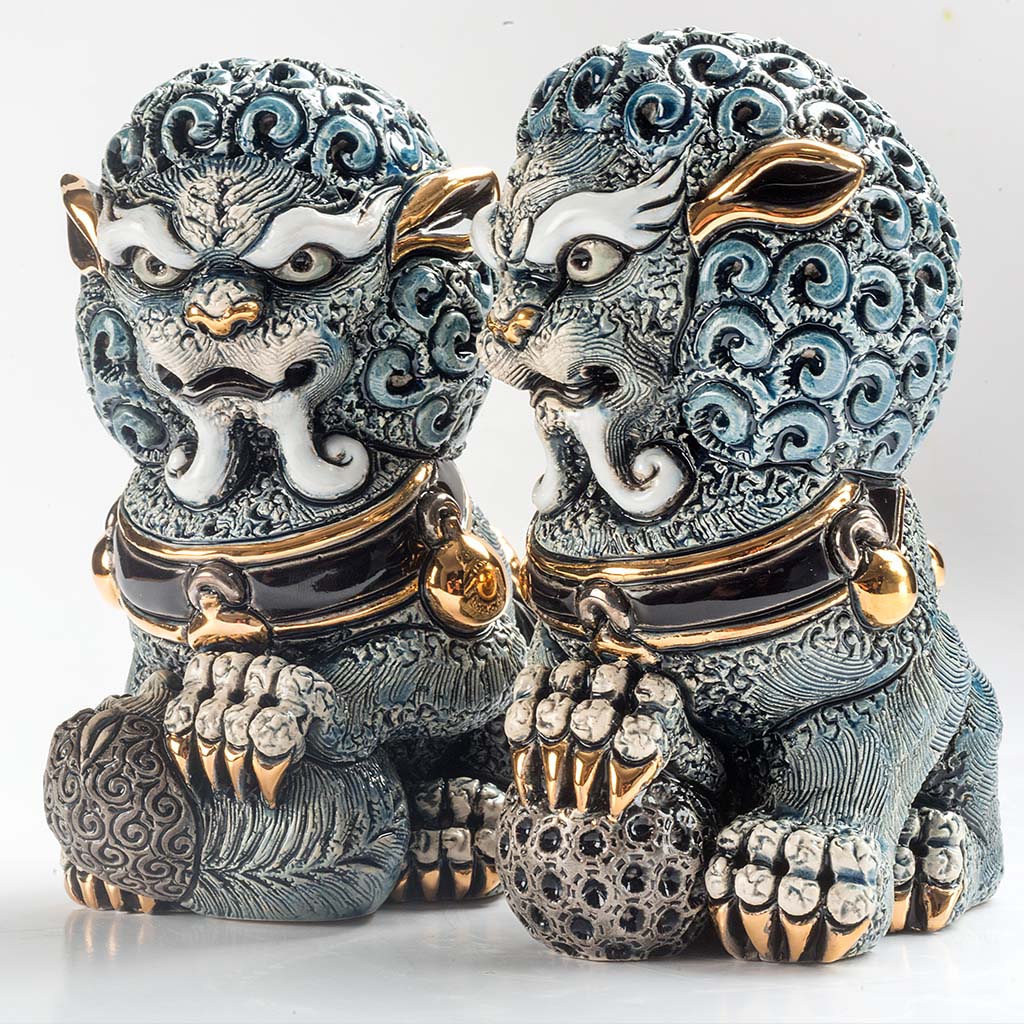 Pair of ceramic Foo Lions hand-carved, soft earthy tones. Detailed mane and poised stances, Chinese feng shui. Lion set for home, office, entryway décor. Hand‑Carved Foo Dog Statue. Lion Figurine. Foo Lion Sculptures. Lion Table Décor
