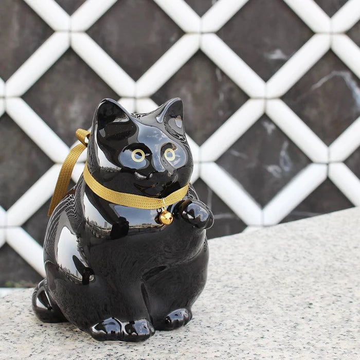 Maneki Neko coin bank, porcelain lucky cat bank, Hizen Yoshida Ware Maneki Neko, KataKoto beckoning cat, Japanese money box cat, black Maneki Neko bank, white Maneki Neko bank, Japanese store opening gift, ceramic cat coin bank, traditional Japanese porcelain cat, chubby lucky cat figurine, handcrafted Maneki Neko Japan, black gold lucky cat ornament, white navy Maneki Neko money bank, Japanese prosperity charm, artisan porcelain Maneki Neko.