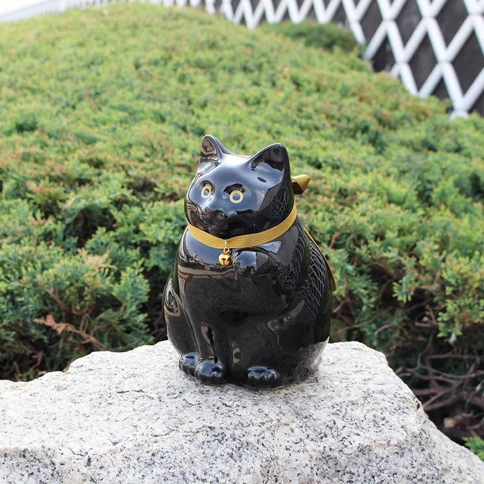 Maneki Neko coin bank, porcelain lucky cat bank, Hizen Yoshida Ware Maneki Neko, KataKoto beckoning cat, Japanese money box cat, black Maneki Neko bank, white Maneki Neko bank, Japanese store opening gift, ceramic cat coin bank, traditional Japanese porcelain cat, chubby lucky cat figurine, handcrafted Maneki Neko Japan, black gold lucky cat ornament, white navy Maneki Neko money bank, Japanese prosperity charm, artisan porcelain Maneki Neko.
