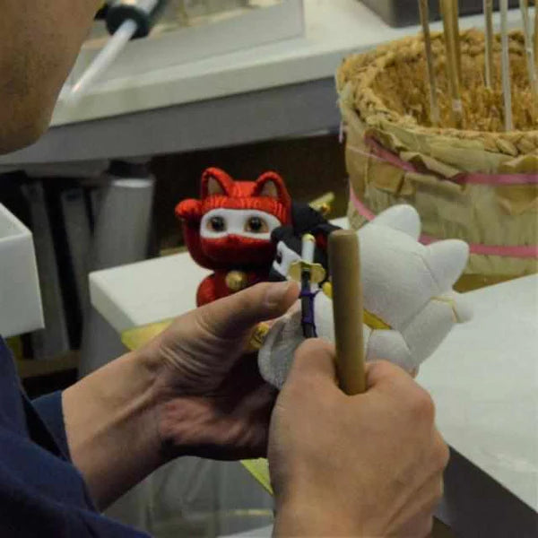 Maneki Neko Nishijin-ori, Japanese beckoning cat doll, Kakinuma Dolls lucky cat, Swarovski crystal Maneki Neko, Edo art doll Japan, traditional Japanese cat figurine, fabric covered Maneki Neko, handmade Japanese lucky charm, Japanese prosperity cat, luxury Maneki Neko ornament, Japanese gift shop lucky cat, artisan Maneki Neko doll, Kyoto silk beckoning cat, collectible Japanese figurine, good luck cat handmade Japan, Maneki Neko for business luck, traditional Japanese home decor, Japanese shop opening gif