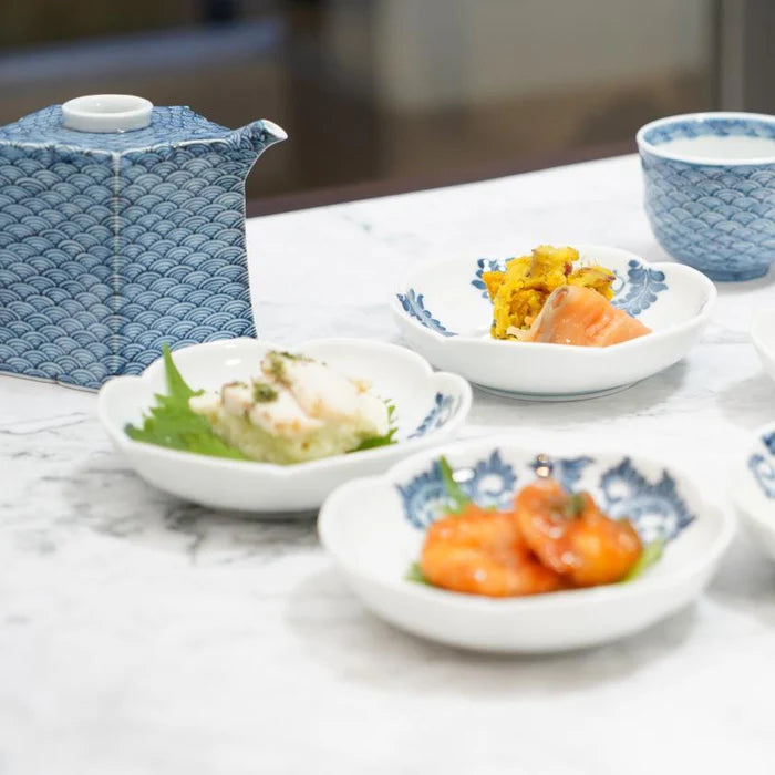 Mikawachi ware porcelain, Hirado Shozan pottery, Seigaiha porcelain set, Japanese wave pattern porcelain, blue and white porcelain Japan, pentagonal porcelain vessel, Japanese porcelain cup set, traditional Japanese tableware, handcrafted Japanese porcelain, Nagasaki porcelain ware, Seigaiha tea set, cultural Japanese giftware, artisanal porcelain Japan, wave motif ceramic set