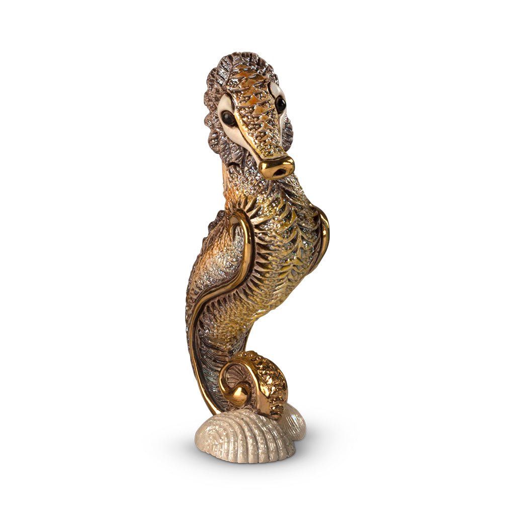 Handcrafted ceramic seahorse figurine with platinum and gold accents, 8×5×14 cm handmade in Uruguay, vibrant enamel glaze details; unique artisanal marine sculpture for coastal décor, gift boxed with authenticity certificate, ideal for collectors and nautical interiors.