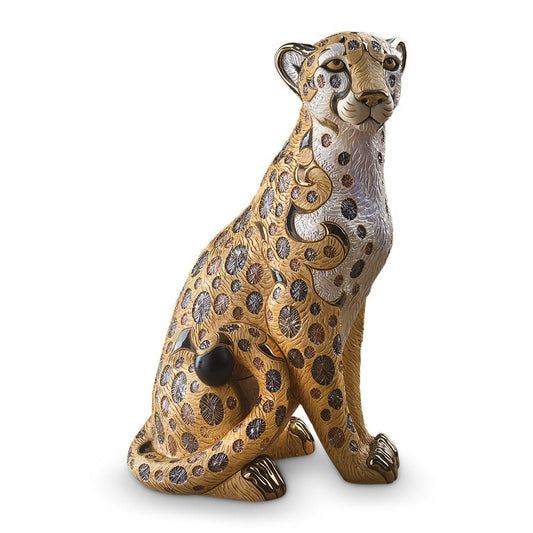 Handmade ceramic animal sculptures, specifically limited edition collectible wildlife figurines. Its materials and craftsmanship place it in the category of fine decorative ceramic art. Cheetah statue, luxury animal figurine, Uruguayan ceramic art, hand-painted ceramic cheetah, and gold-accented cheetah sculpture.