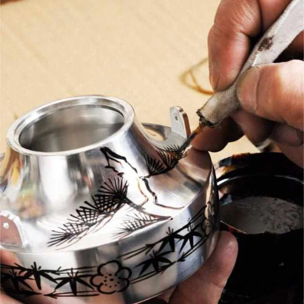 Japanese tea set, ibushi tin tea set, Osaka Naniwa pewter ware, Japanese pewter tea cups, handmade Japanese tea set, traditional tea ceremony set, Japanese tea caddy, Japanese tin teapot, artisan tea set Japan, paulownia wood box tea set, Edo period tea ware, pewter tea set Japan, Japanese tea culture, Japanese traditional crafts, Osaka Suzuki tea set.