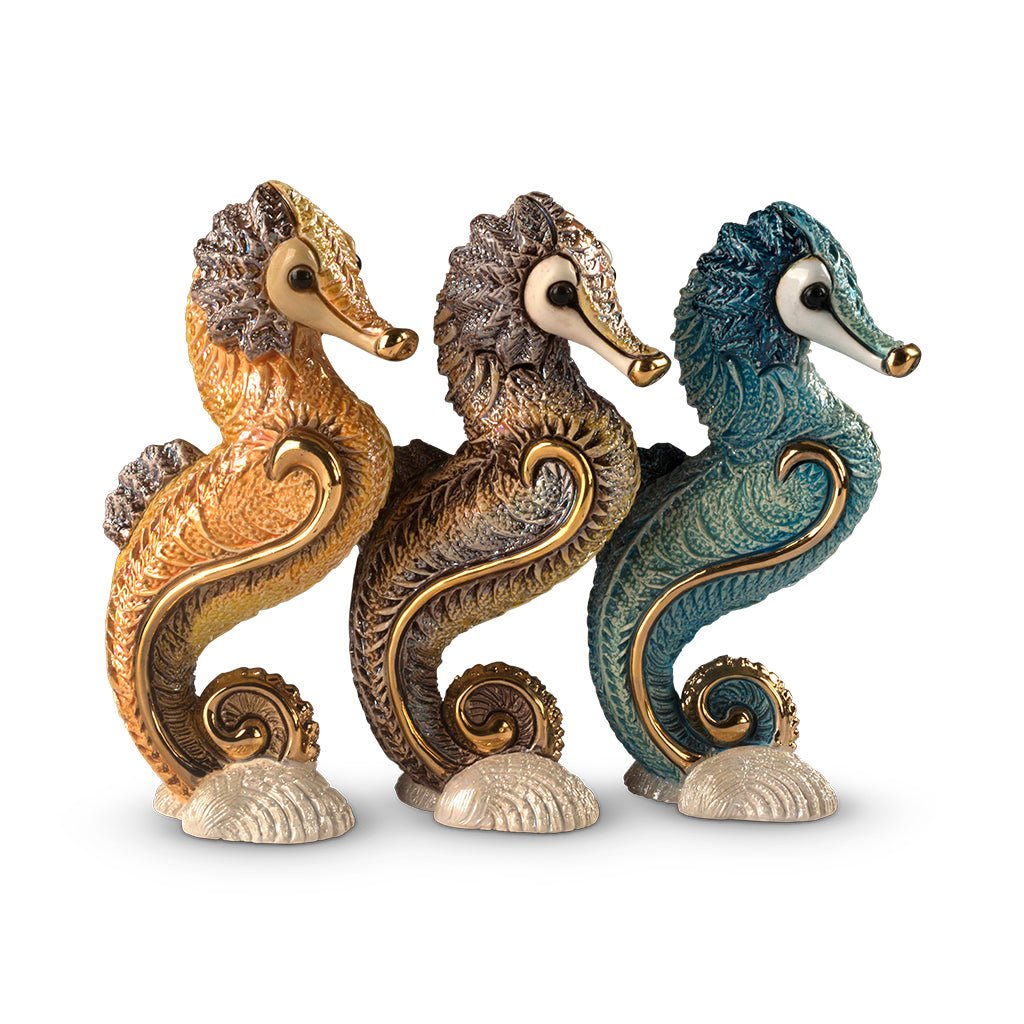 Handcrafted ceramic seahorse figurine with platinum and gold accents, 8×5×14 cm handmade in Uruguay, vibrant enamel glaze details; unique artisanal marine sculpture for coastal décor, gift boxed with authenticity certificate, ideal for collectors and nautical interiors.