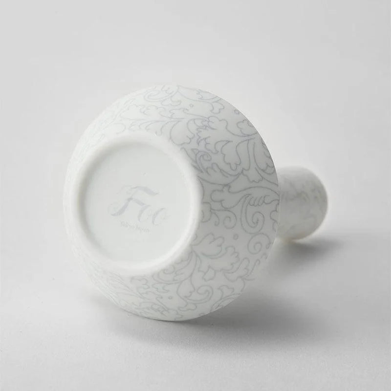 Foo Tokyo porcelain vase, Japanese porcelain flower vase, Mino Gifu handcrafted vase, acanthus motif vase, karakusa pattern vase, gray porcelain vase Japan, white porcelain vase Japan, modern Japanese home decor, single flower porcelain vase, minimalist Japanese vase, artisan handmade porcelain vase, symbolic Japanese ceramic, contemporary Japanese pottery