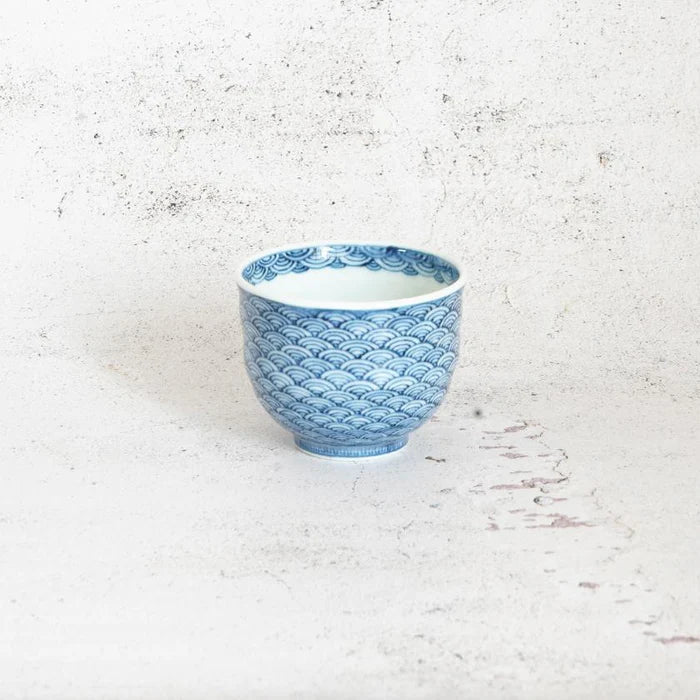 Mikawachi ware porcelain, Hirado Shozan pottery, Seigaiha porcelain set, Japanese wave pattern porcelain, blue and white porcelain Japan, pentagonal porcelain vessel, Japanese porcelain cup set, traditional Japanese tableware, handcrafted Japanese porcelain, Nagasaki porcelain ware, Seigaiha tea set, cultural Japanese giftware, artisanal porcelain Japan, wave motif ceramic set