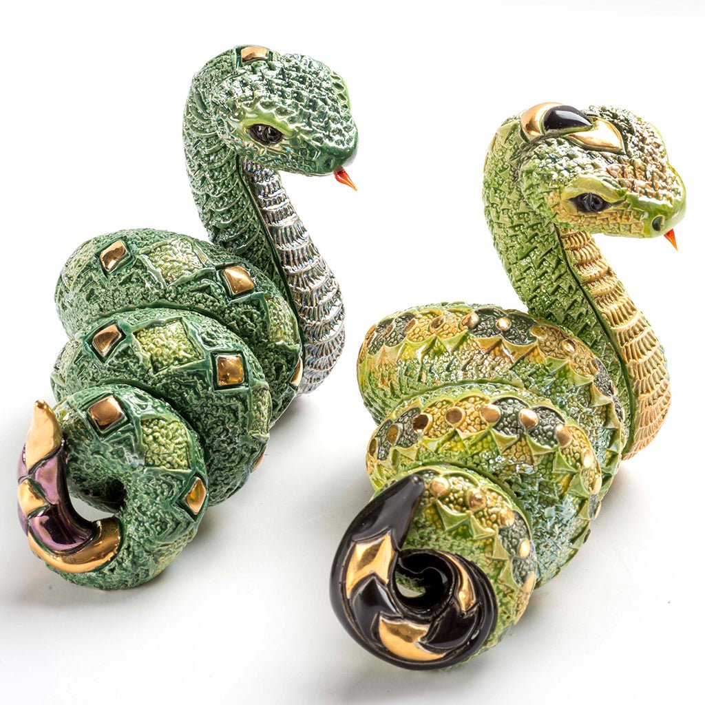 Artisan Ceramic Snake Sculpture. Hand‑Painted Coiled Snake Figurine. Gold‑Accent Ceramic Snake Decor. Enamel Glazed Snake Statue. Uruguayan Craft Ceramic Serpent. Hand‑Carved Snake Home Accent. Snake Transformation Symbol Figurine. Tabletop Ceramic Animal Sculpture