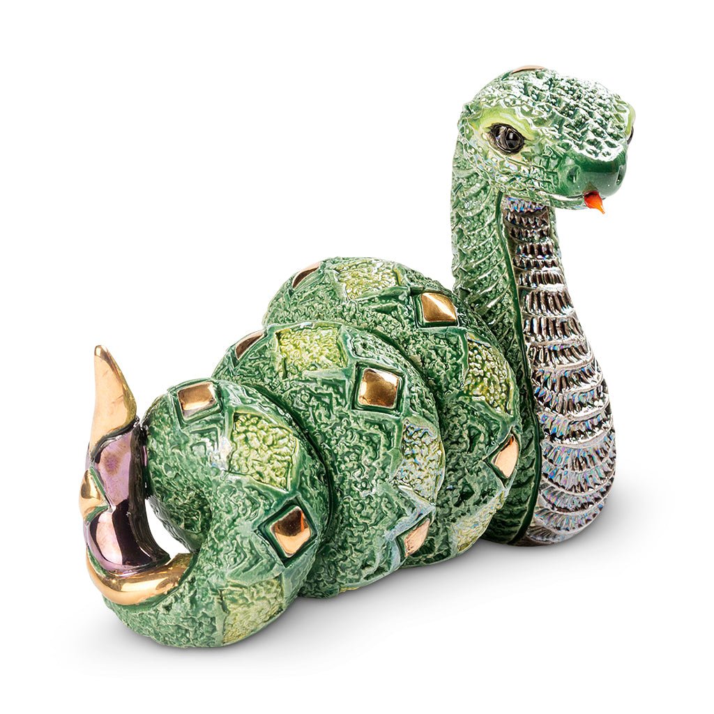 Artisan Ceramic Snake Sculpture. Hand‑Painted Coiled Snake Figurine. Gold‑Accent Ceramic Snake Decor. Enamel Glazed Snake Statue. Uruguayan Craft Ceramic Serpent. Hand‑Carved Snake Home Accent. Snake Transformation Symbol Figurine. Tabletop Ceramic Animal Sculpture