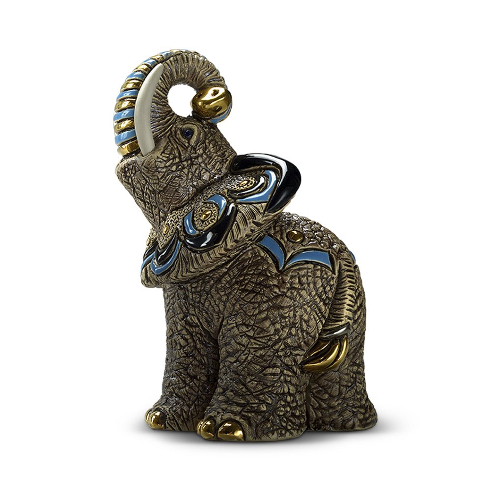Hand‑carved ceramic elephant figurine with blue painted accents and detailed surface patterns, 12×10×17 cm artisan sculpture symbolizing wisdom, strength, crafted in Uruguay, ideal home décor or wildlife gift. Handcrafted Savanna Wisdom Elephant Decor. Elephant Statuette.