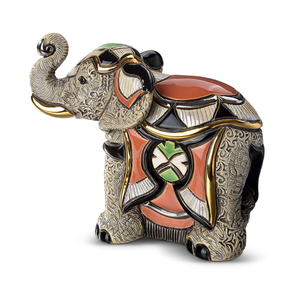 Hand‑carved wooden Asian elephant figurine, 20×10×12 cm, with metallic paint accents and detailed patterns, symbolizing wisdom and strength, perfect for home or office décor. Artisan Asian Elephant Tabletop Statue. Cultural Heritage Elephant Sculpture.