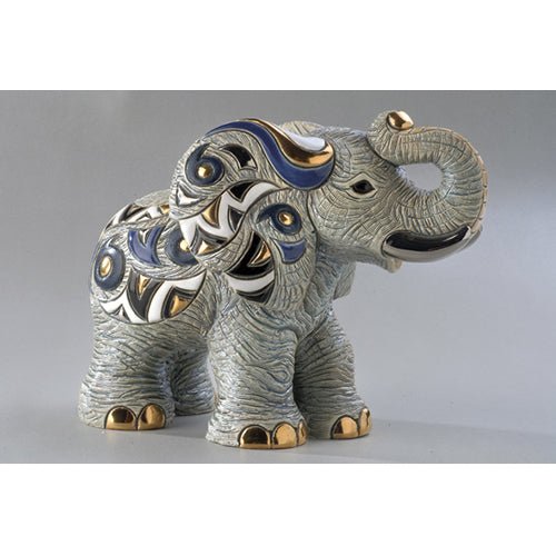 Handcrafted African elephant ceramic figurine with gold, blue, and white patterns, raised trunk for good luck. Symbol of wisdom, strength, and good fortune. Ceramic Symbol of Strength & Luck.