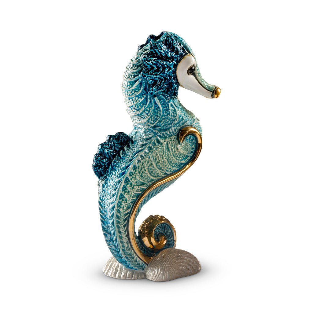 Handcrafted ceramic seahorse figurine with platinum and gold accents, 8×5×14 cm handmade in Uruguay, vibrant enamel glaze details; unique artisanal marine sculpture for coastal décor, gift boxed with authenticity certificate, ideal for collectors and nautical interiors.