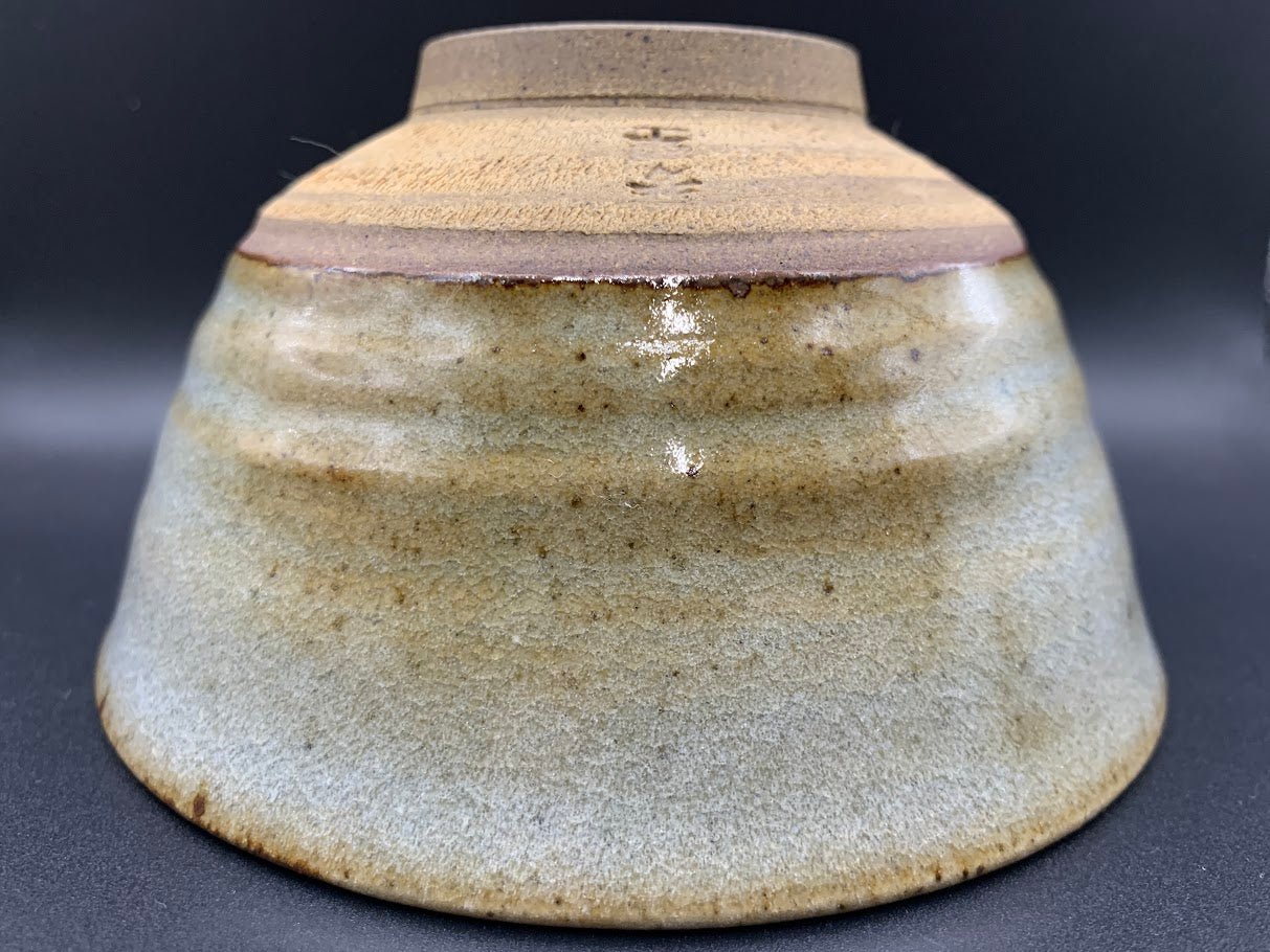 Japanese celadon pottery, handmade celadon tea bowl, ribbed ceramic tea bowl, carved leaf motif pottery, traditional Japanese ceramics, Longquan-style celadon ware, matcha chawan bowl, artisanal tea ceremony bowl, crackle glaze pottery, Song dynasty style ceramics, Japanese green glaze bowl, hand-thrown Japanese pottery, tea culture ceramics, Japanese chawan design, antique-style Japanese bowl, leaf pattern pottery, ribbed matcha bowl, celadon carving techniques, Japanese celadon glaze art, traditional Japa