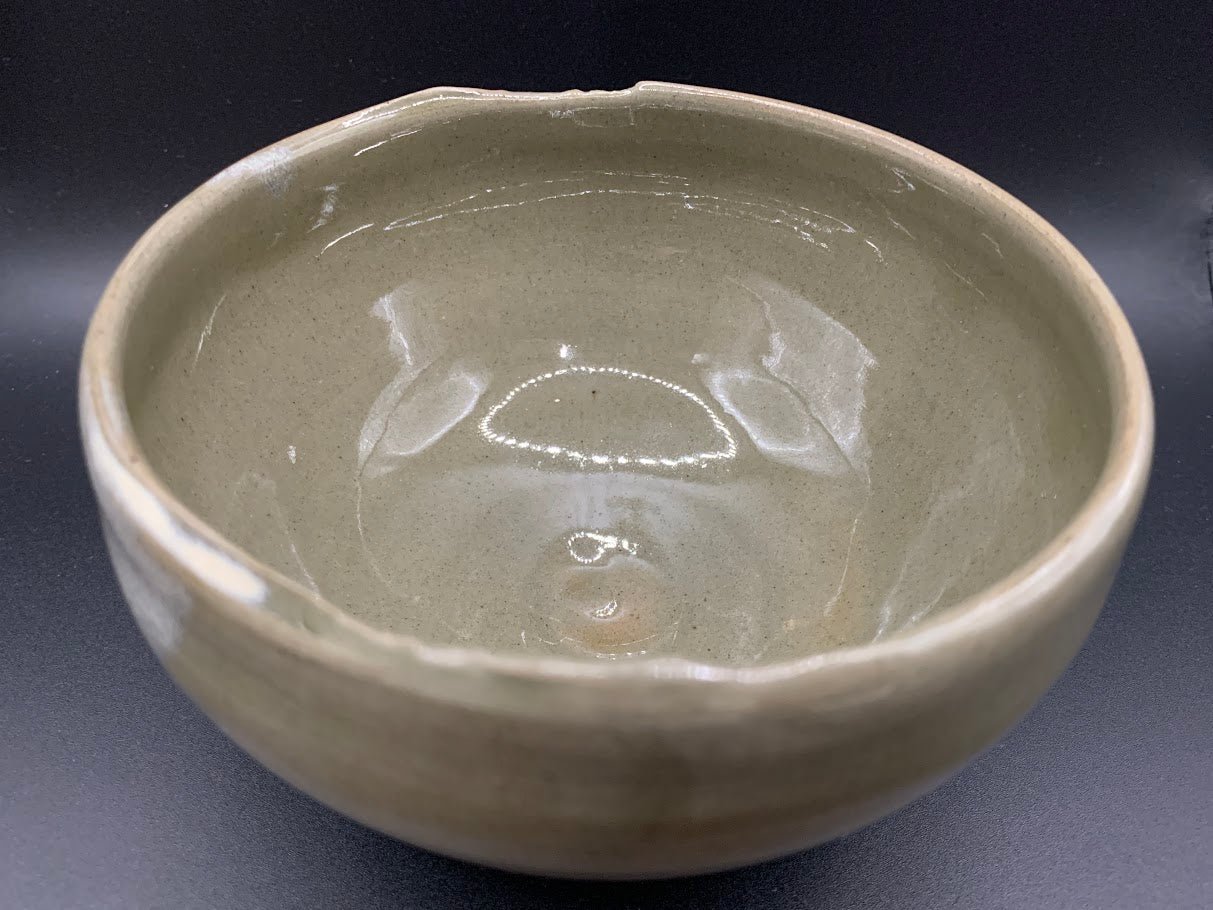 Japanese celadon pottery, handmade celadon tea bowl, ribbed ceramic tea bowl, carved leaf motif pottery, traditional Japanese ceramics, Longquan-style celadon ware, matcha chawan bowl, artisanal tea ceremony bowl, crackle glaze pottery, Song dynasty style ceramics, Japanese green glaze bowl, hand-thrown Japanese pottery, tea culture ceramics, Japanese chawan design, antique-style Japanese bowl, leaf pattern pottery, ribbed matcha bowl, celadon carving techniques, Japanese celadon glaze art, traditional Japa
