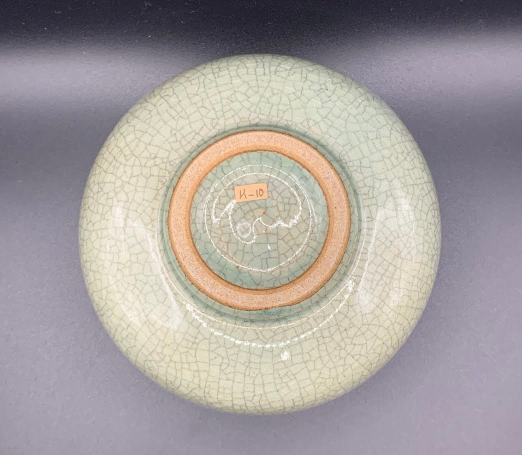 Japanese celadon pottery, handmade celadon tea bowl, ribbed ceramic tea bowl, carved leaf motif pottery, traditional Japanese ceramics, Longquan-style celadon ware, matcha chawan bowl, artisanal tea ceremony bowl, crackle glaze pottery, Song dynasty style ceramics, Japanese green glaze bowl, hand-thrown Japanese pottery, tea culture ceramics, Japanese chawan design, antique-style Japanese bowl, leaf pattern pottery, ribbed matcha bowl, celadon carving techniques, Japanese celadon glaze art, traditional Japa
