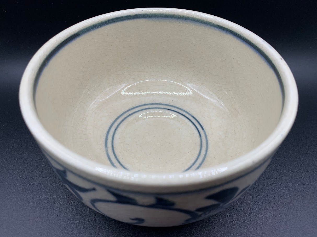 Japanese celadon pottery, handmade celadon tea bowl, ribbed ceramic tea bowl, carved leaf motif pottery, traditional Japanese ceramics, Longquan-style celadon ware, matcha chawan bowl, artisanal tea ceremony bowl, crackle glaze pottery, Song dynasty style ceramics, Japanese green glaze bowl, hand-thrown Japanese pottery, tea culture ceramics, Japanese chawan design, antique-style Japanese bowl, leaf pattern pottery, ribbed matcha bowl, celadon carving techniques, Japanese celadon glaze art, traditional Japa