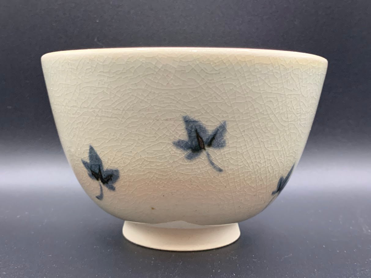 Japanese celadon pottery, handmade celadon tea bowl, ribbed ceramic tea bowl, carved leaf motif pottery, traditional Japanese ceramics, Longquan-style celadon ware, matcha chawan bowl, artisanal tea ceremony bowl, crackle glaze pottery, Song dynasty style ceramics, Japanese green glaze bowl, hand-thrown Japanese pottery, tea culture ceramics, Japanese chawan design, antique-style Japanese bowl, leaf pattern pottery, ribbed matcha bowl, celadon carving techniques, Japanese celadon glaze art, traditional Japa