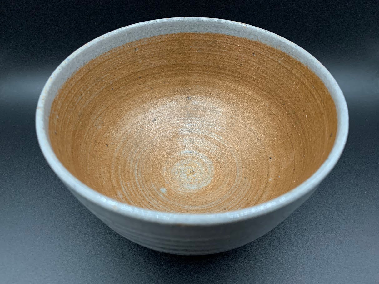 Japanese celadon pottery, handmade celadon tea bowl, ribbed ceramic tea bowl, carved leaf motif pottery, traditional Japanese ceramics, Longquan-style celadon ware, matcha chawan bowl, artisanal tea ceremony bowl, crackle glaze pottery, Song dynasty style ceramics, Japanese green glaze bowl, hand-thrown Japanese pottery, tea culture ceramics, Japanese chawan design, antique-style Japanese bowl, leaf pattern pottery, ribbed matcha bowl, celadon carving techniques, Japanese celadon glaze art, traditional Japa