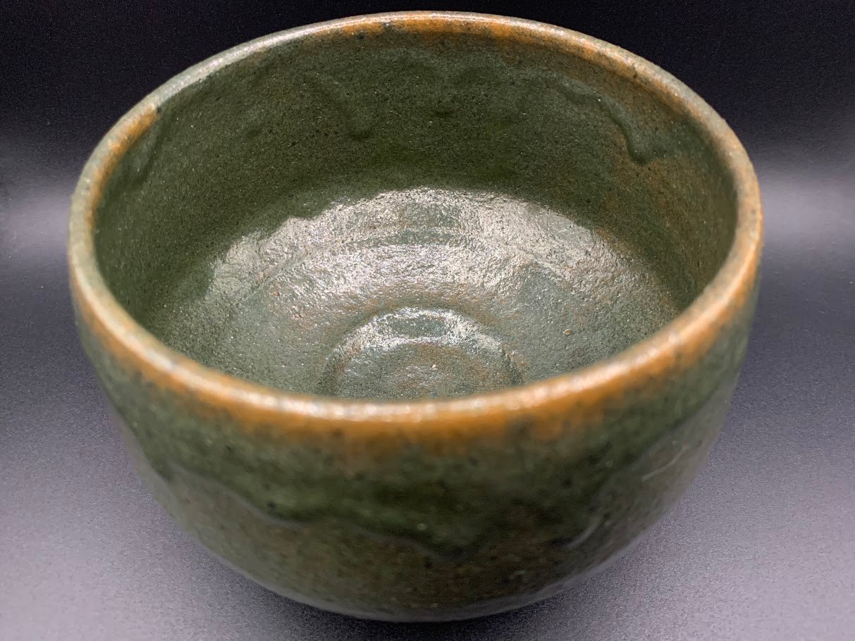Japanese celadon pottery, handmade celadon tea bowl, ribbed ceramic tea bowl, carved leaf motif pottery, traditional Japanese ceramics, Longquan-style celadon ware, matcha chawan bowl, artisanal tea ceremony bowl, crackle glaze pottery, Song dynasty style ceramics, Japanese green glaze bowl, hand-thrown Japanese pottery, tea culture ceramics, Japanese chawan design, antique-style Japanese bowl, leaf pattern pottery, ribbed matcha bowl, celadon carving techniques, Japanese celadon glaze art, traditional Japa