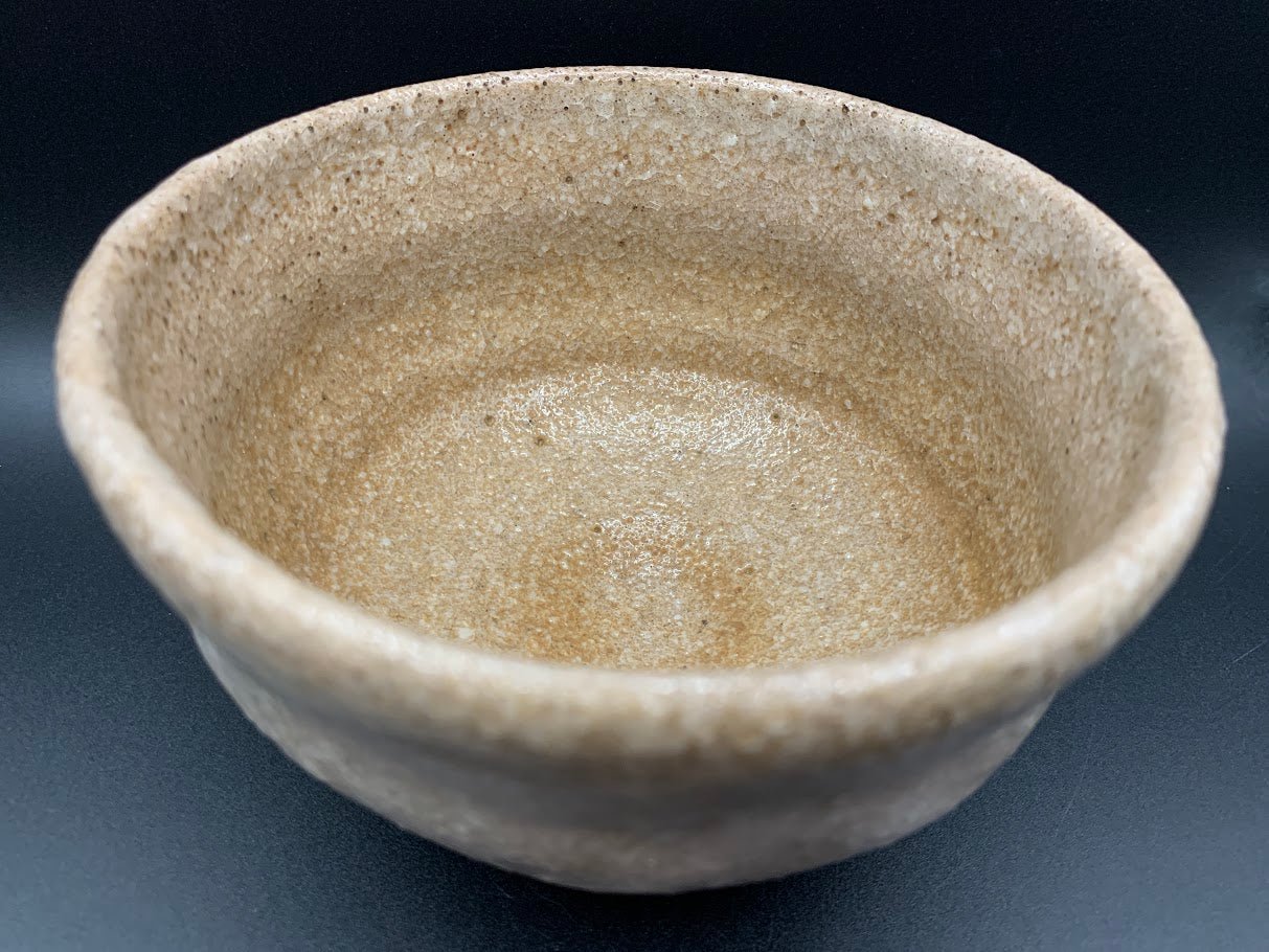 Japanese celadon pottery, handmade celadon tea bowl, ribbed ceramic tea bowl, carved leaf motif pottery, traditional Japanese ceramics, Longquan-style celadon ware, matcha chawan bowl, artisanal tea ceremony bowl, crackle glaze pottery, Song dynasty style ceramics, Japanese green glaze bowl, hand-thrown Japanese pottery, tea culture ceramics, Japanese chawan design, antique-style Japanese bowl, leaf pattern pottery, ribbed matcha bowl, celadon carving techniques, Japanese celadon glaze art, traditional Japa