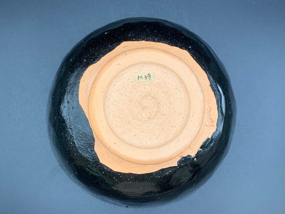 Japanese celadon pottery, handmade celadon tea bowl, ribbed ceramic tea bowl, carved leaf motif pottery, traditional Japanese ceramics, Longquan-style celadon ware, matcha chawan bowl, artisanal tea ceremony bowl, crackle glaze pottery, Song dynasty style ceramics, Japanese green glaze bowl, hand-thrown Japanese pottery, tea culture ceramics, Japanese chawan design, antique-style Japanese bowl, leaf pattern pottery, ribbed matcha bowl, celadon carving techniques, Japanese celadon glaze art, traditional Japa