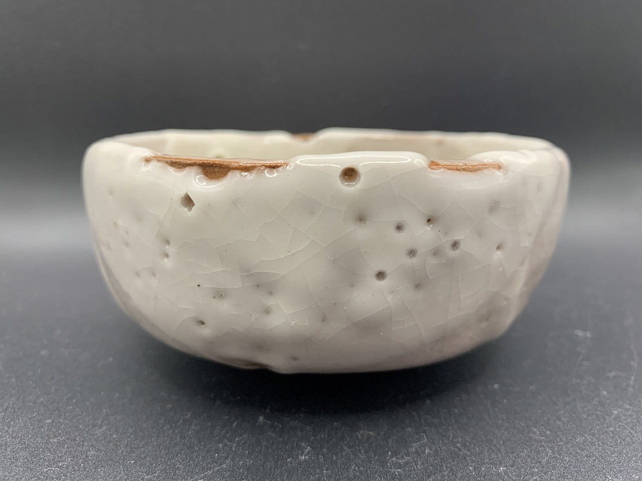 Japanese celadon pottery, handmade celadon tea bowl, ribbed ceramic tea bowl, carved leaf motif pottery, traditional Japanese ceramics, Longquan-style celadon ware, matcha chawan bowl, artisanal tea ceremony bowl, crackle glaze pottery, Song dynasty style ceramics, Japanese green glaze bowl, hand-thrown Japanese pottery, tea culture ceramics, Japanese chawan design, antique-style Japanese bowl, leaf pattern pottery, ribbed matcha bowl, celadon carving techniques, Japanese celadon glaze art, traditional Japa