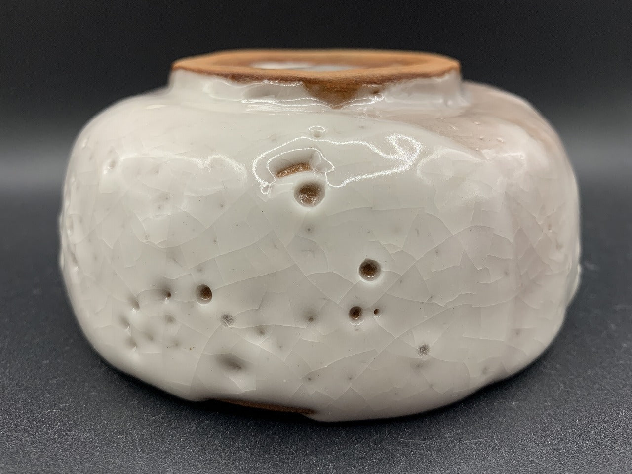 Japanese celadon pottery, handmade celadon tea bowl, ribbed ceramic tea bowl, carved leaf motif pottery, traditional Japanese ceramics, Longquan-style celadon ware, matcha chawan bowl, artisanal tea ceremony bowl, crackle glaze pottery, Song dynasty style ceramics, Japanese green glaze bowl, hand-thrown Japanese pottery, tea culture ceramics, Japanese chawan design, antique-style Japanese bowl, leaf pattern pottery, ribbed matcha bowl, celadon carving techniques, Japanese celadon glaze art, traditional Japa