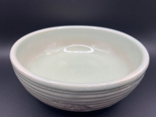 Japanese celadon pottery, handmade celadon tea bowl, ribbed ceramic tea bowl, carved leaf motif pottery, traditional Japanese ceramics, Longquan-style celadon ware, matcha chawan bowl, artisanal tea ceremony bowl, crackle glaze pottery, Song dynasty style ceramics, Japanese green glaze bowl, hand-thrown Japanese pottery, tea culture ceramics, Japanese chawan design, antique-style Japanese bowl, leaf pattern pottery, ribbed matcha bowl, celadon carving techniques, Japanese celadon glaze art, traditional Japa