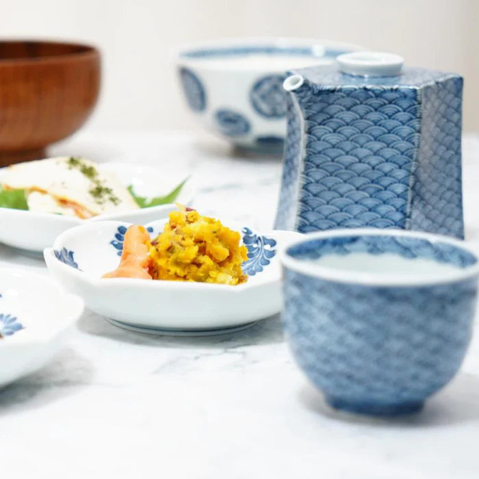 Mikawachi ware porcelain, Hirado Shozan pottery, Seigaiha porcelain set, Japanese wave pattern porcelain, blue and white porcelain Japan, pentagonal porcelain vessel, Japanese porcelain cup set, traditional Japanese tableware, handcrafted Japanese porcelain, Nagasaki porcelain ware, Seigaiha tea set, cultural Japanese giftware, artisanal porcelain Japan, wave motif ceramic set