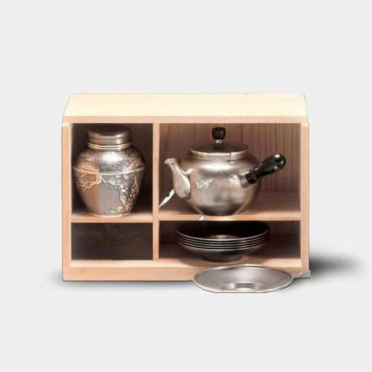 Japanese tea set, ibushi tin tea set, Osaka Naniwa pewter ware, Japanese pewter tea cups, handmade Japanese tea set, traditional tea ceremony set, Japanese tea caddy, Japanese tin teapot, artisan tea set Japan, paulownia wood box tea set, Edo period tea ware, pewter tea set Japan, Japanese tea culture, Japanese traditional crafts, Osaka Suzuki tea set.