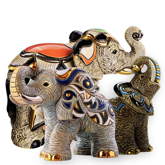 Handcrafted Asian elephant figurine. African elephant ceramic statue. Decorative elephant sculpture set. Elephant figurines with gold accents. Artisan elephant home decor. Cultural elephant collectible trio. Enamel-painted elephant sculptures. Global elephant figurine set. Elephant symbols of strength and wisdom. Elephant décor handmade in Uruguay. Elephant sculpture gift set