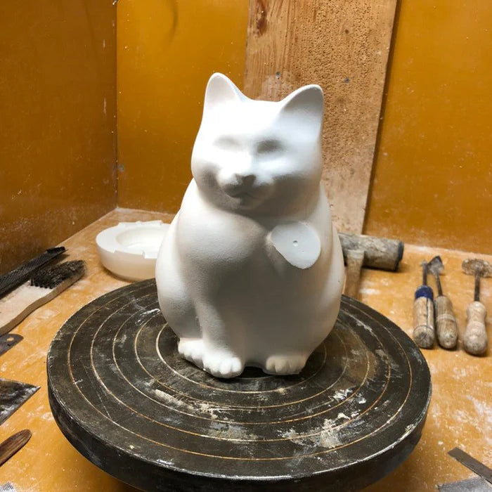 Maneki Neko coin bank, porcelain lucky cat bank, Hizen Yoshida Ware Maneki Neko, KataKoto beckoning cat, Japanese money box cat, black Maneki Neko bank, white Maneki Neko bank, Japanese store opening gift, ceramic cat coin bank, traditional Japanese porcelain cat, chubby lucky cat figurine, handcrafted Maneki Neko Japan, black gold lucky cat ornament, white navy Maneki Neko money bank, Japanese prosperity charm, artisan porcelain Maneki Neko.
