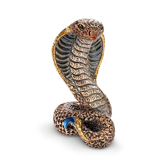 Hand-carved ceramic cobra figurine with enamel glaze, plated gold and platinum detailing. Measures approx 12×8×9 cm. Unique artisan sculpture from Uruguay. Ideal for collector’s display, spiritual décor, office accent, or thoughtful gift. Artisan ceramic snake sculpture. Small decorative cobra collectible. Handmade platinum-detail snake figurine.