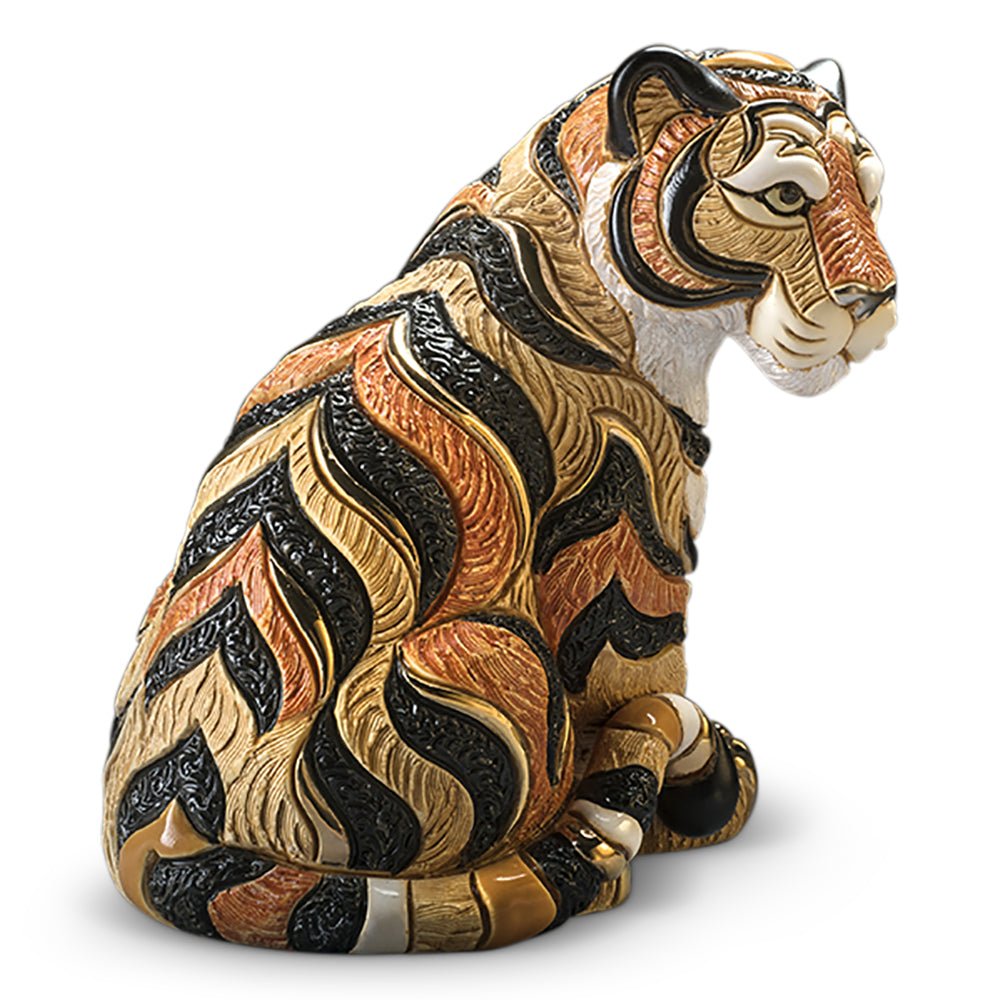 Hand‑Carved Tiger Figurine. Sitting Tiger Animal Sculpture. Artisan Wildlife ceramic Carving. Gold & Platinum Accent Tiger Statue. Symbolic Power Animal Figure. Rustic Tiger Home Décor Piece. Compact Office Desk Wildlife Art. Uruguay Hand‑Painted Animal Statuette. Courage Symbol Animal Sculpture. Tiger Gift Boxed Art Piece.
