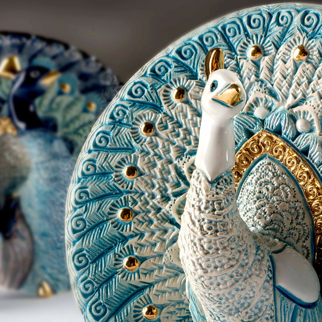 Hand‑carved enamel peacock figurine with gold and platinum accents. Compact symbol of beauty, renewal. Gift‑boxed with authenticity.