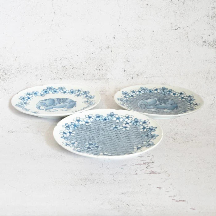 Mikawachi ware porcelain plate, Hirado Shouzan porcelain, Japanese cherry blossom plate, elephant design porcelain, blue and white Japanese plate, Japanese ocean wave pattern dish, Mikawachi large plate set, traditional Japanese porcelain, Japanese symbolic dinnerware, handmade Japanese porcelain gift, Nagasaki porcelain plates, sakura and elephant plate set, Japanese auspicious porcelain, collectible Japanese dish set