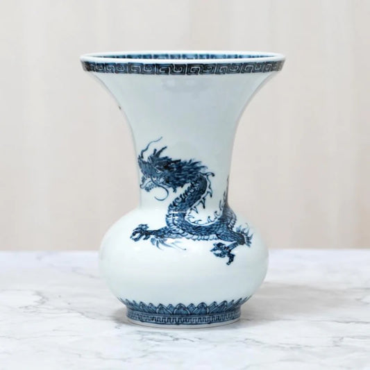 Mikawachi ware vase, Japanese dragon vase, Hirado Shozan porcelain, blue and white porcelain vase, Nagasaki pottery, Japanese porcelain art, indigo dragon vase, traditional Japanese ceramics, dragon motif home décor, Japanese gift vase, blue dragon porcelain, Asian dragon symbolism vase, hand-painted porcelain Japan, Japanese decorative vase, luxury porcelain home décor, Mikawachi dragon design, cultural Japanese gifts, auspicious Japanese art