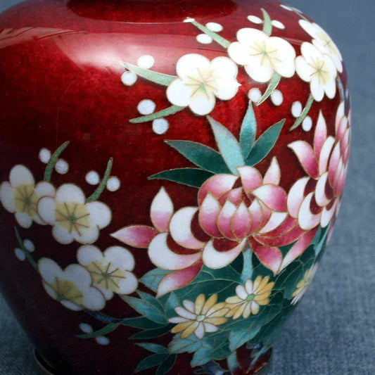 Owari Cloisonné vase, Japanese cloisonné enamel, Four Gentlemen motif vase, chrysanthemum orchid plum bamboo vase, traditional Japanese enamelware, red cloisonné vase, small Japanese vase, Song dynasty inspired vase, Japanese floral symbolism, collectible cloisonné art, handmade Japanese enamel vase, Japanese gift décor, shippo-yaki vase, cloisonné pottery Japan