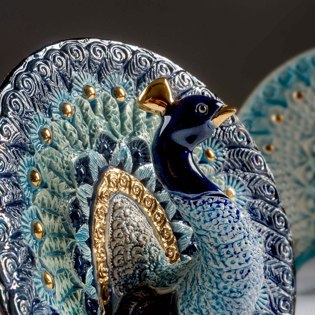 Hand‑carved enamel peacock figurine with gold and platinum accents. Compact symbol of beauty, renewal. Gift‑boxed with authenticity.