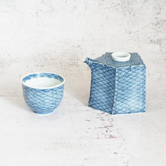Mikawachi ware porcelain, Hirado Shozan pottery, Seigaiha porcelain set, Japanese wave pattern porcelain, blue and white porcelain Japan, pentagonal porcelain vessel, Japanese porcelain cup set, traditional Japanese tableware, handcrafted Japanese porcelain, Nagasaki porcelain ware, Seigaiha tea set, cultural Japanese giftware, artisanal porcelain Japan, wave motif ceramic set