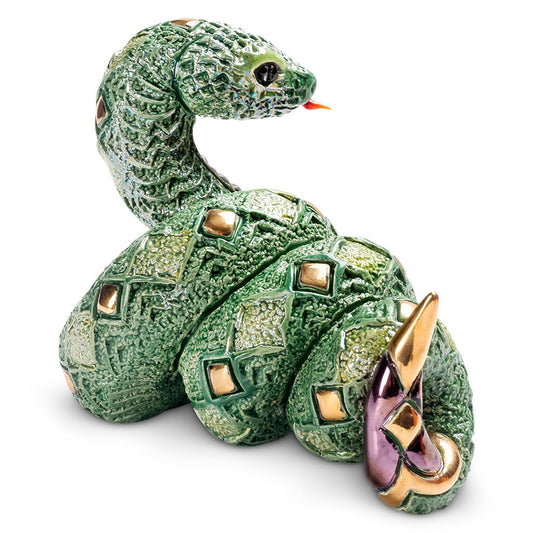 Artisan Ceramic Snake Sculpture. Hand‑Painted Coiled Snake Figurine. Gold‑Accent Ceramic Snake Decor. Enamel Glazed Snake Statue. Uruguayan Craft Ceramic Serpent. Hand‑Carved Snake Home Accent. Snake Transformation Symbol Figurine. Tabletop Ceramic Animal Sculpture