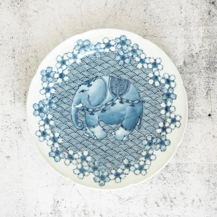 Mikawachi ware porcelain plate, Hirado Shouzan porcelain, Japanese cherry blossom plate, elephant design porcelain, blue and white Japanese plate, Japanese ocean wave pattern dish, Mikawachi large plate set, traditional Japanese porcelain, Japanese symbolic dinnerware, handmade Japanese porcelain gift, Nagasaki porcelain plates, sakura and elephant plate set, Japanese auspicious porcelain, collectible Japanese dish set