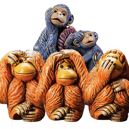 Ceramic monkey figurines set. See no evil hear no evil speak no evil statues. Handmade animal figurines De Rosa. Primate collectible sculptures. Symbolic monkey figurines. Blue and orange monkey art décor. Enamel orangutan statuettes. Artisan ceramic monkey gifts. South American monkey sculptures. Thoughtful home décor monkey set