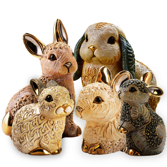Ceramic rabbit figurines set. Handmade bunny statue collection. Artisan rabbit decor. Enamel bunny sculptures. Lop eared bunny statue. Small ceramic animals decor. Gold-accented rabbit collectibles. Easter bunny figurines. De Rosa bunny collectibles. Miniature handmade rabbit set