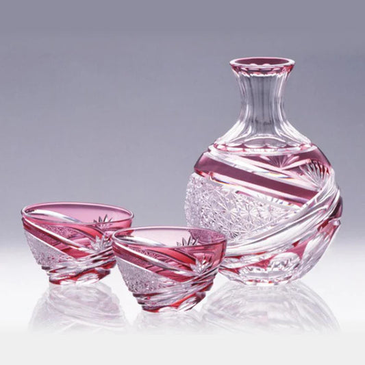 Edo Kiriko sake set, Kagami Crystal Edo glass, Japanese cut glass sake set, chrysanthemum motif glassware, bamboo leaf design crystal, red crystal sake cups, Japanese crystal carafe, traditional Japanese drinkware, handmade Edo Kiriko glass, luxury sake set Japan, symbolic Japanese glassware, artisan Japanese glass, Kagami Crystal sake carafe and cups, red Edo Kiriko gift set, cultural Japanese tableware