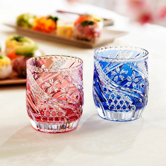 Edo Kiriko whiskey glasses, Sakura Nagare glass, Kagami Crystal Japan, Japanese cherry blossom glass, red and blue whiskey tumblers, Edo cut glass pair, handcrafted Japanese glassware, whiskey glass Edo Kiriko, sake glass Japan, Kagome cut pattern, Kiku Tsunagi design, Japanese crystal barware, cherry blossom whiskey glass set, luxury Japanese drinkware